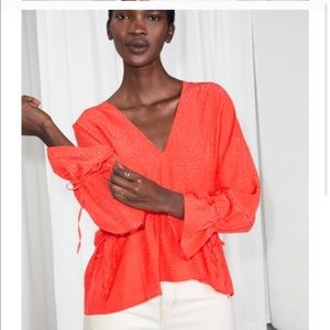 Orange blouse with dots